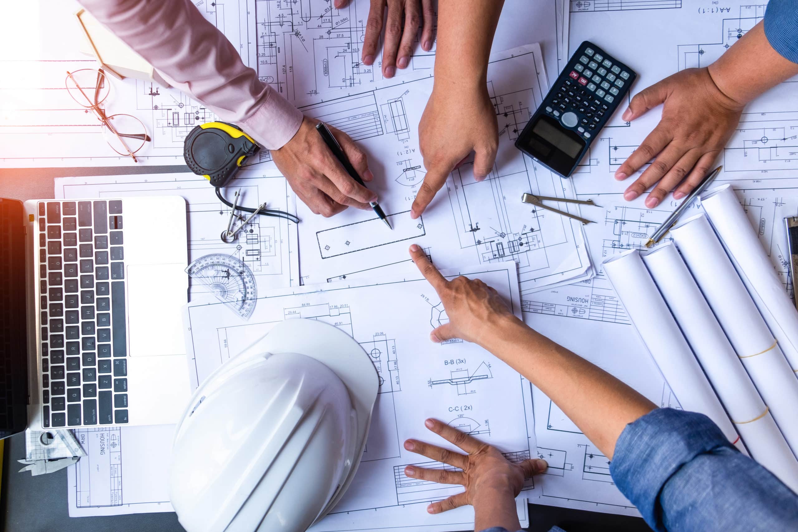 Archectict and Engineer Team reviewing project plans