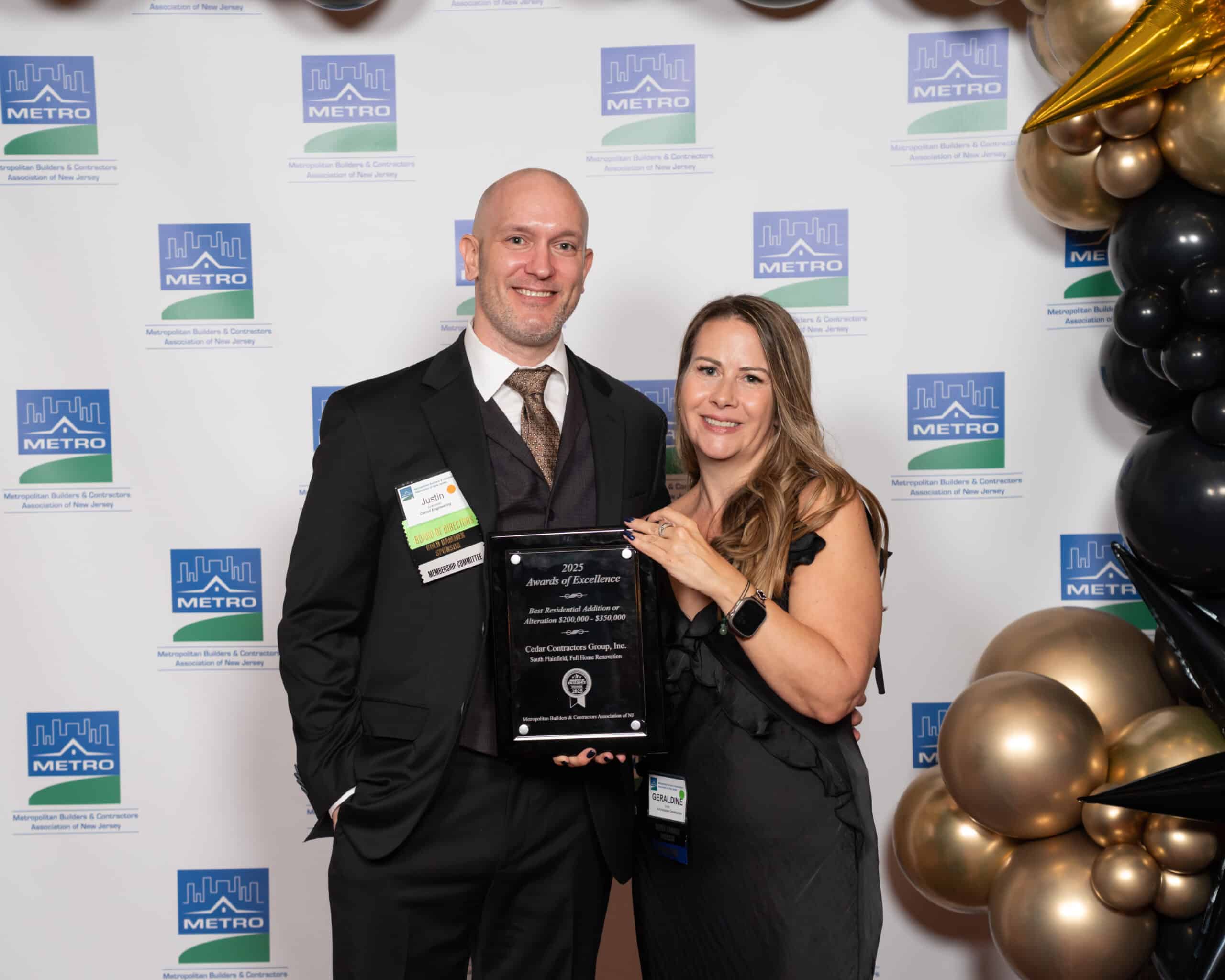 Justin Jurkowski receiving his awards: Best Engineering Design – Site Design – Surveying – Client: SESI Best Engineering Design – Best Use of Survey Technology – Client: Arcadis