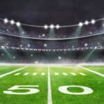 green field in american football stadium. ready for game