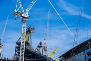 Construction crane building a sports stadium 