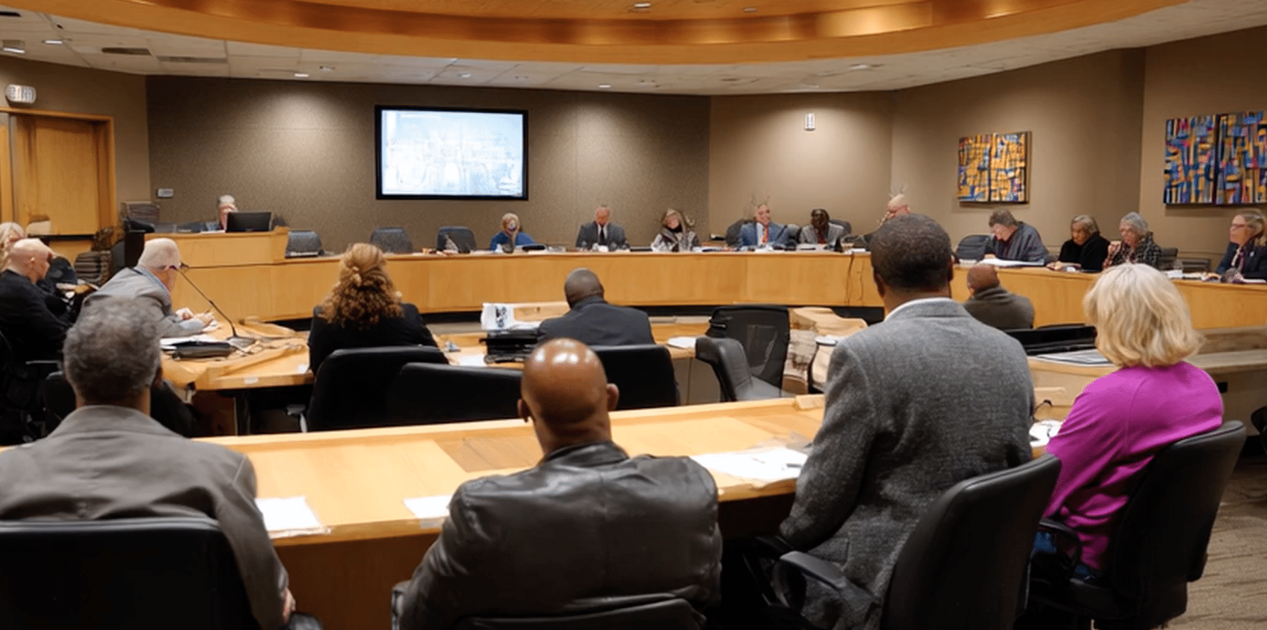 Municipal planning board at a variance hearing in the process of approving a variance